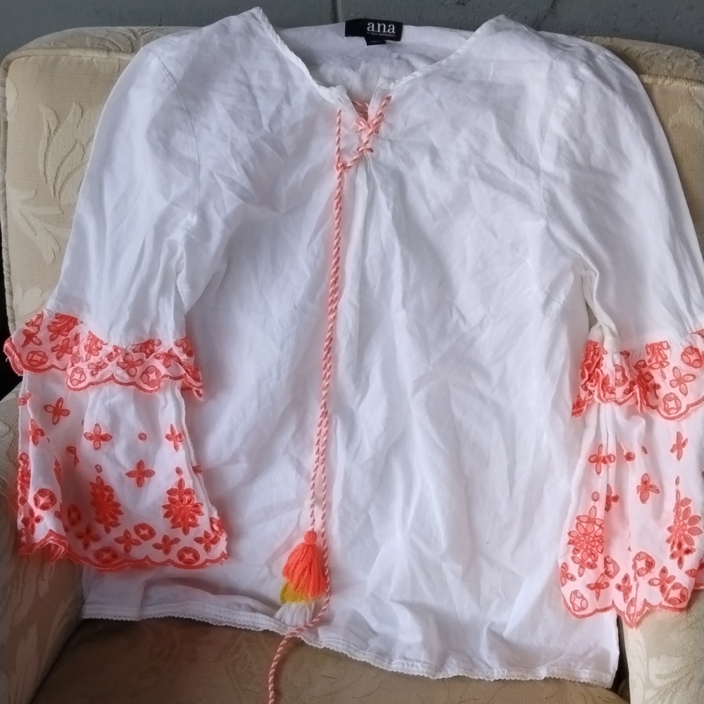 A white and orange blouse
